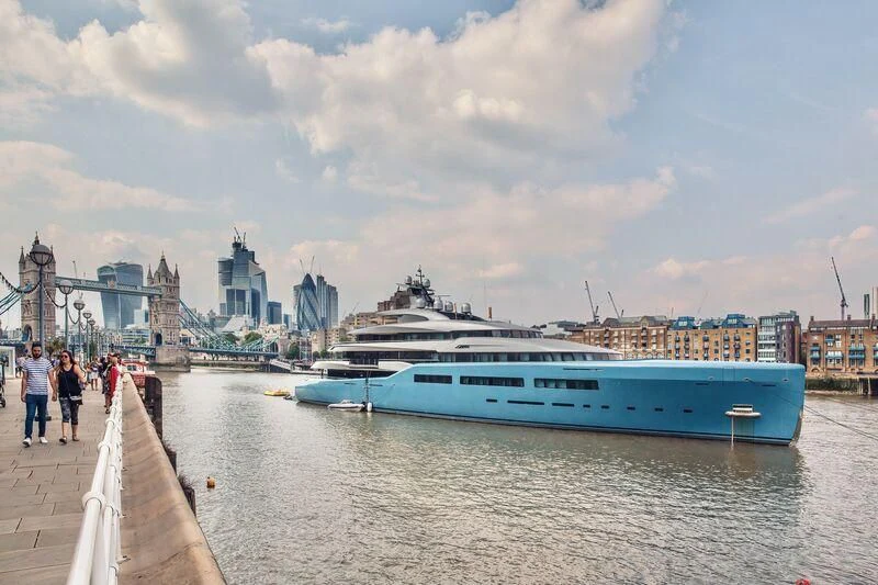 a large boat is parked on a dock aboard AVIVA Yacht for Sale