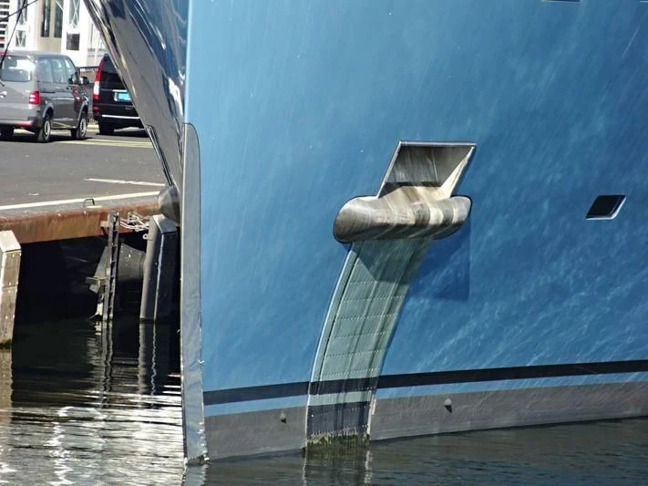 a large blue wall with a metal object on it aboard AVIVA Yacht for Sale