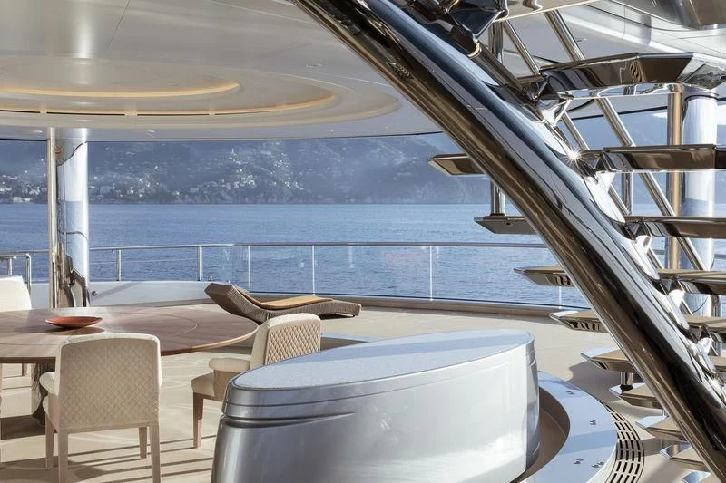 a room with a table and chairs aboard AVIVA Yacht for Sale