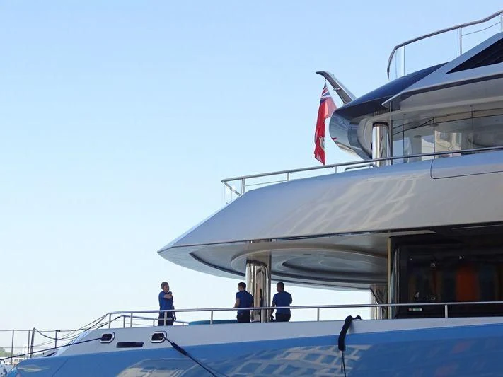 a couple of people standing on a boat aboard AVIVA Yacht for Sale