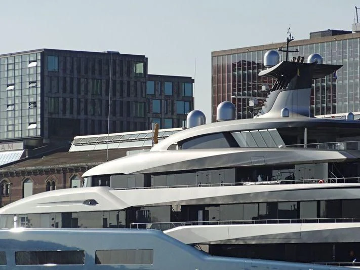 a helicopter flying over a building aboard AVIVA Yacht for Sale