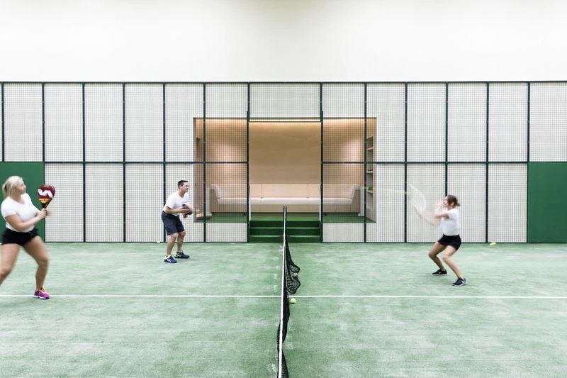 a group of people playing tennis aboard AVIVA Yacht for Sale