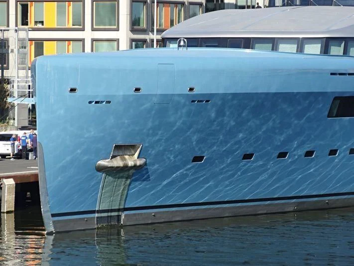 a large blue boat on the water aboard AVIVA Yacht for Sale