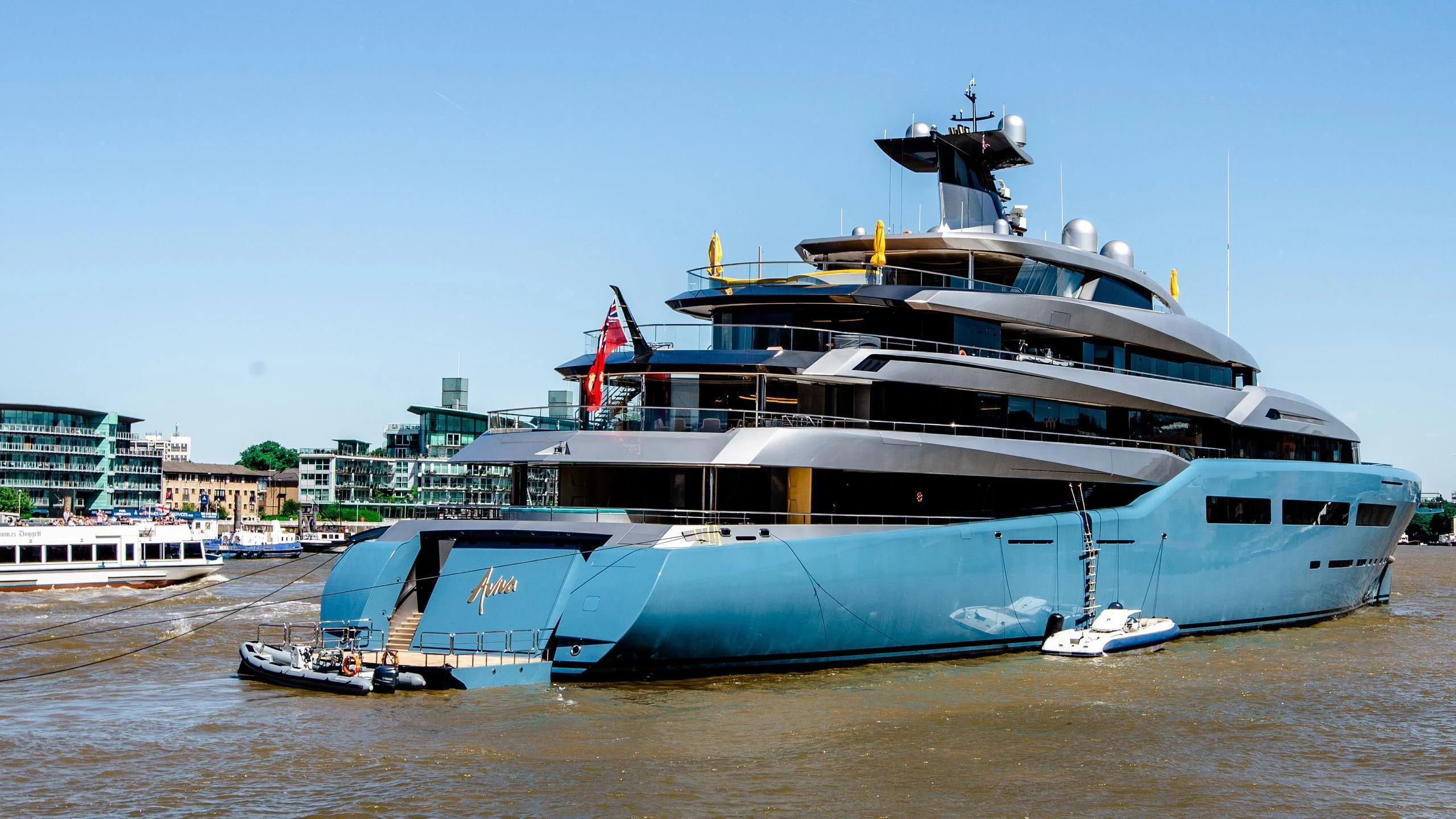a large ship docked at a port aboard AVIVA Yacht for Sale