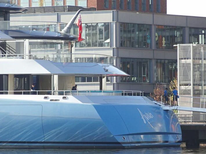 a pool in front of a building aboard AVIVA Yacht for Sale