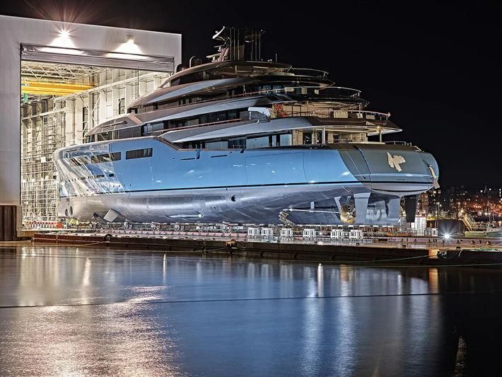 a cruise ship docked at night aboard AVIVA Yacht for Sale