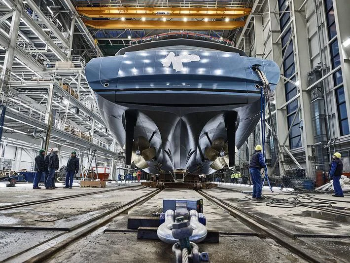 a large metal object with people around it aboard AVIVA Yacht for Sale