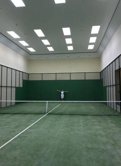 a woman playing tennis aboard AVIVA Yacht for Sale