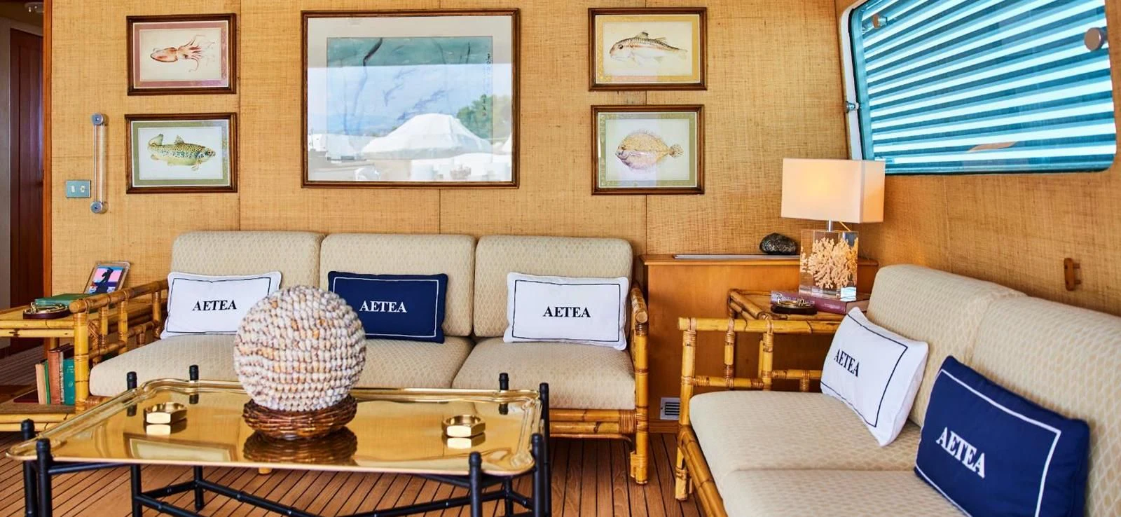 a living room with a couch and a coffee table aboard AETEA Yacht for Sale