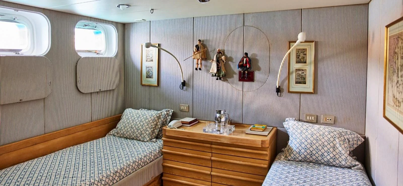 a room with a dresser and a bed aboard AETEA Yacht for Sale