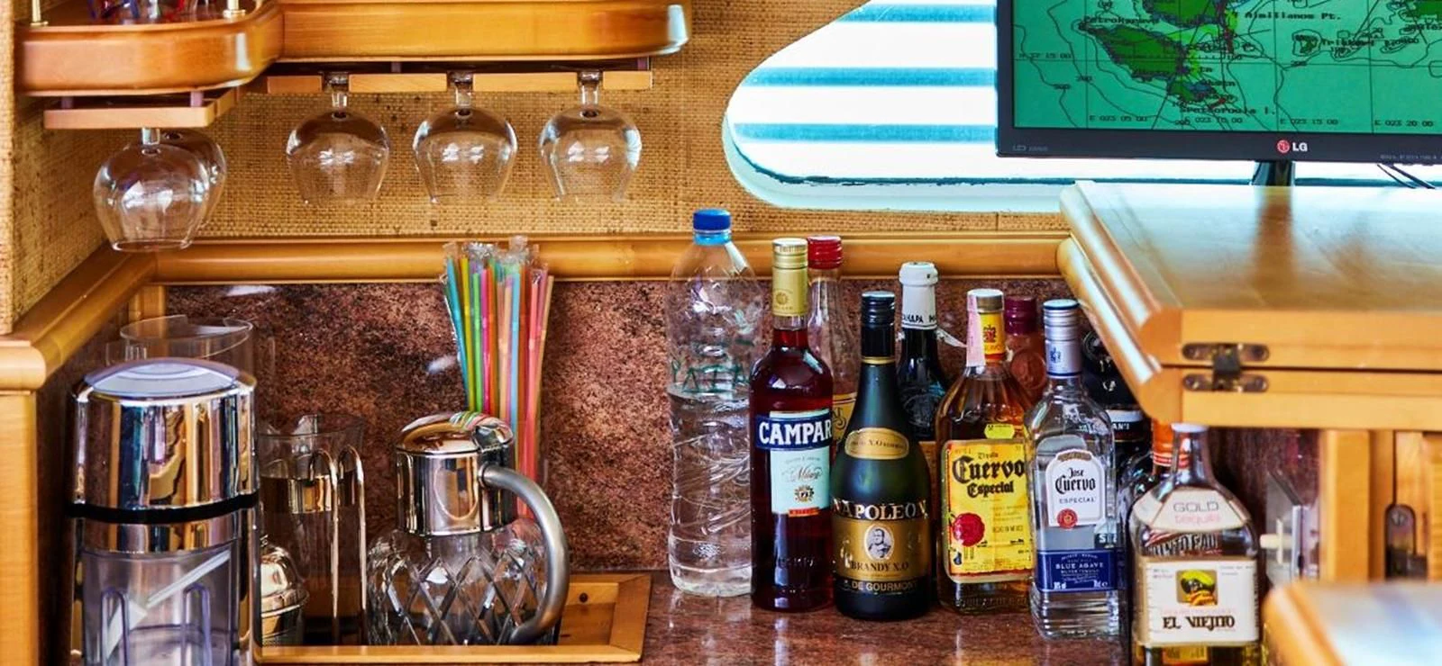 a shelf with bottles and a coffee maker aboard AETEA Yacht for Sale