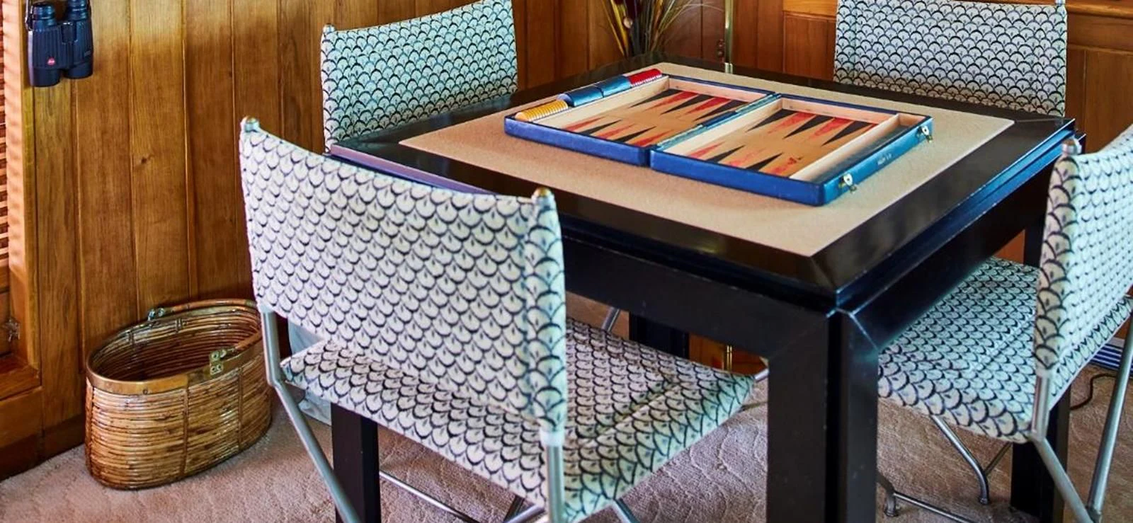 a table with chairs and a basket on it aboard AETEA Yacht for Sale