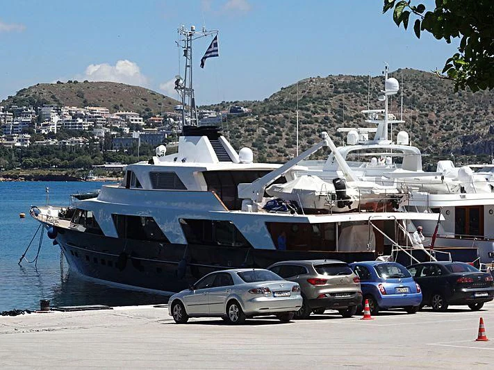 cars parked near a boat aboard AETEA Yacht for Sale