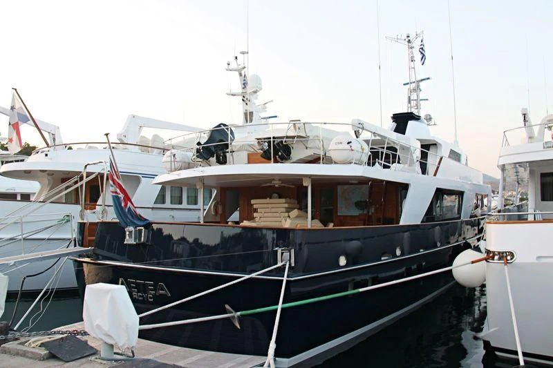 a boat docked at a pier aboard AETEA Yacht for Sale