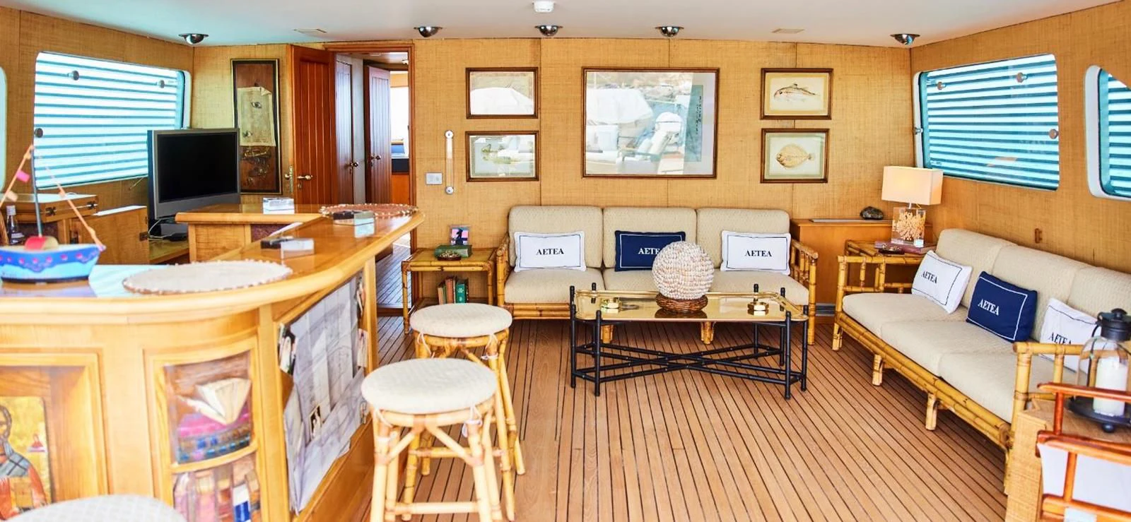 a living room with a couch and a television aboard AETEA Yacht for Sale