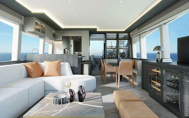 a living room with a white couch and a table aboard UNA CAPRA Yacht for Sale