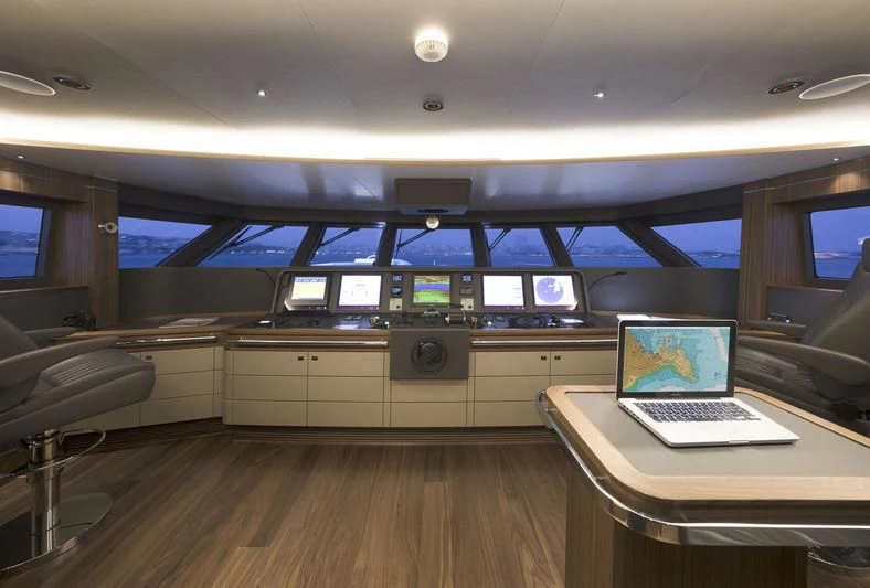 a laptop on a table aboard RASHA Yacht for Sale