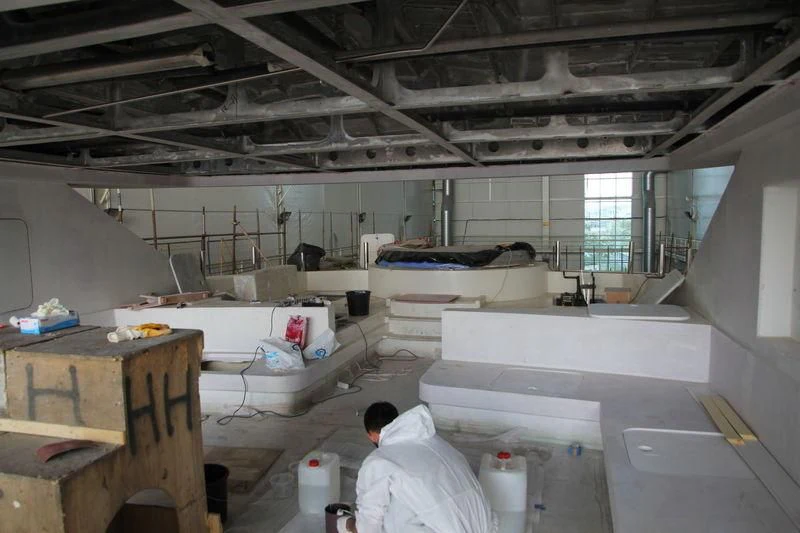 a room with tables and chairs aboard RASHA Yacht for Sale
