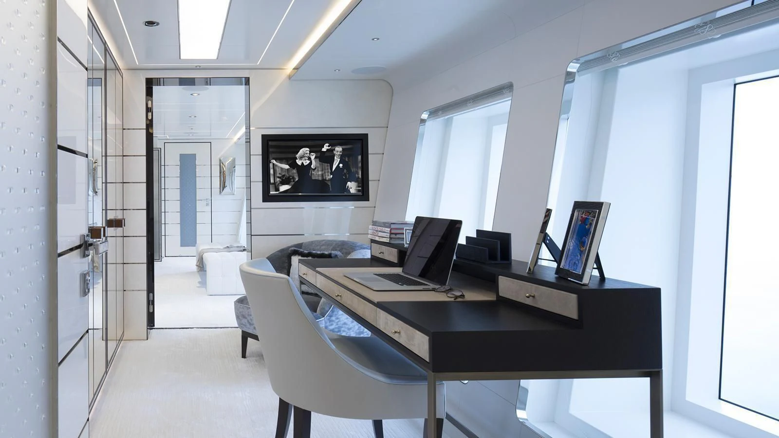 a room with a desk and a chair aboard RASHA Yacht for Sale
