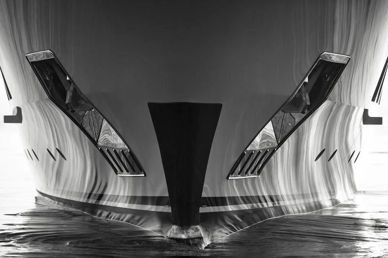 a black and white photo of a tall building with a staircase aboard RASHA Yacht for Sale