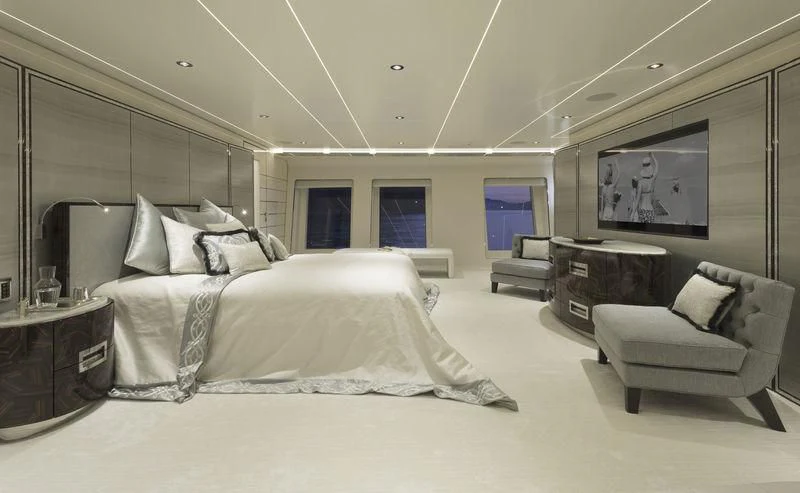 a large bedroom with a large bed aboard RASHA Yacht for Sale