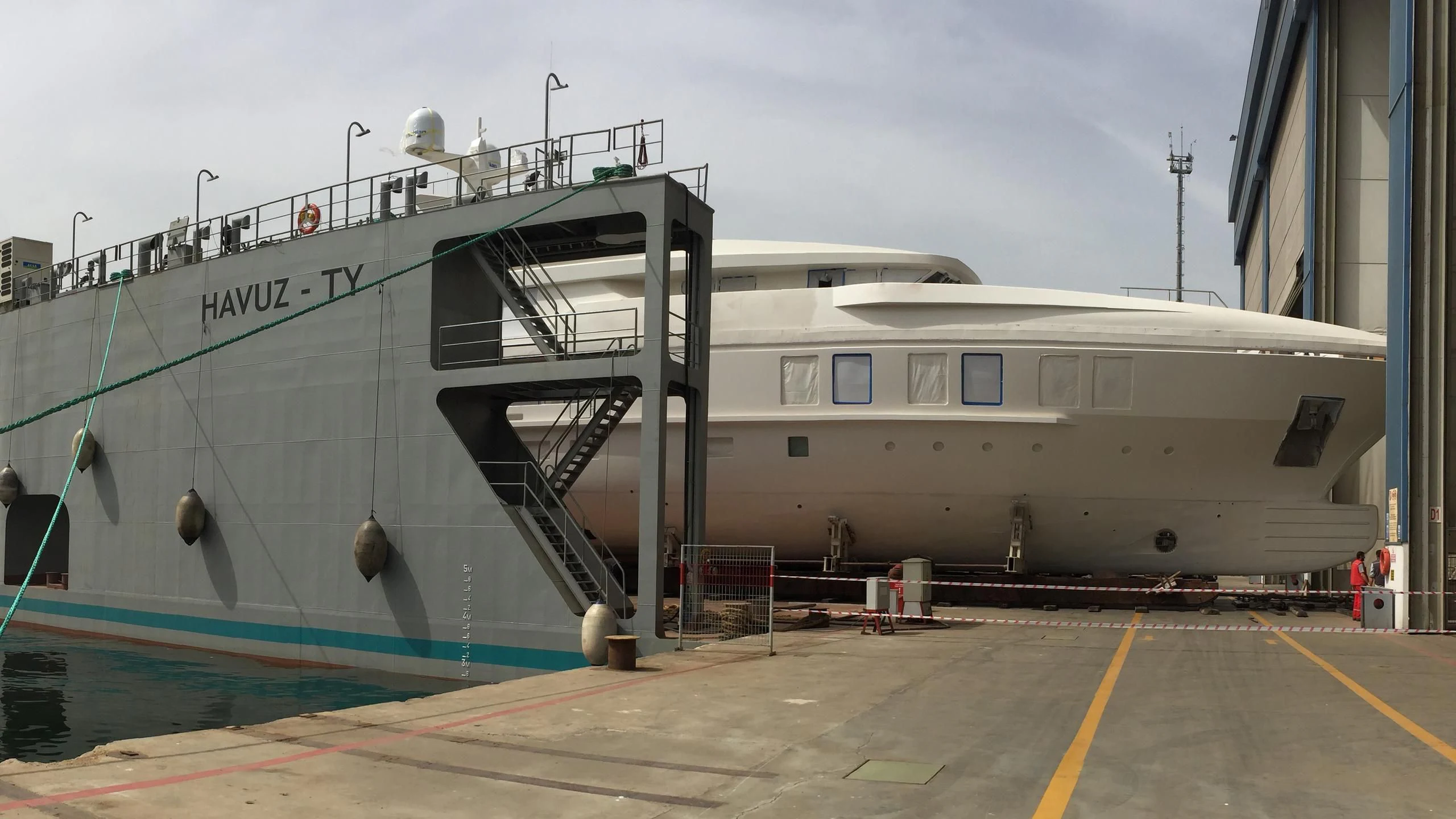 a large ship docked aboard RASHA Yacht for Sale