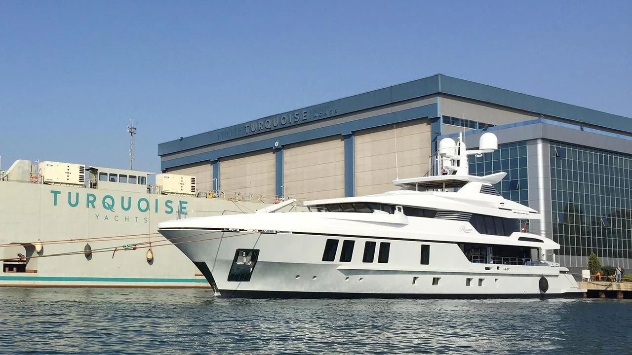 a large white boat in the water aboard RASHA Yacht for Sale