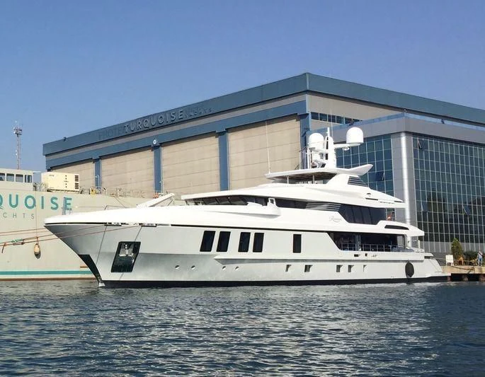 a large white boat in the water aboard RASHA Yacht for Sale