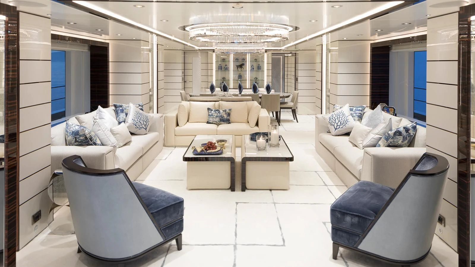 a living room with white furniture aboard RASHA Yacht for Sale