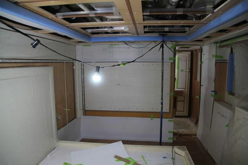 a room with a whiteboard and blue walls aboard RASHA Yacht for Sale