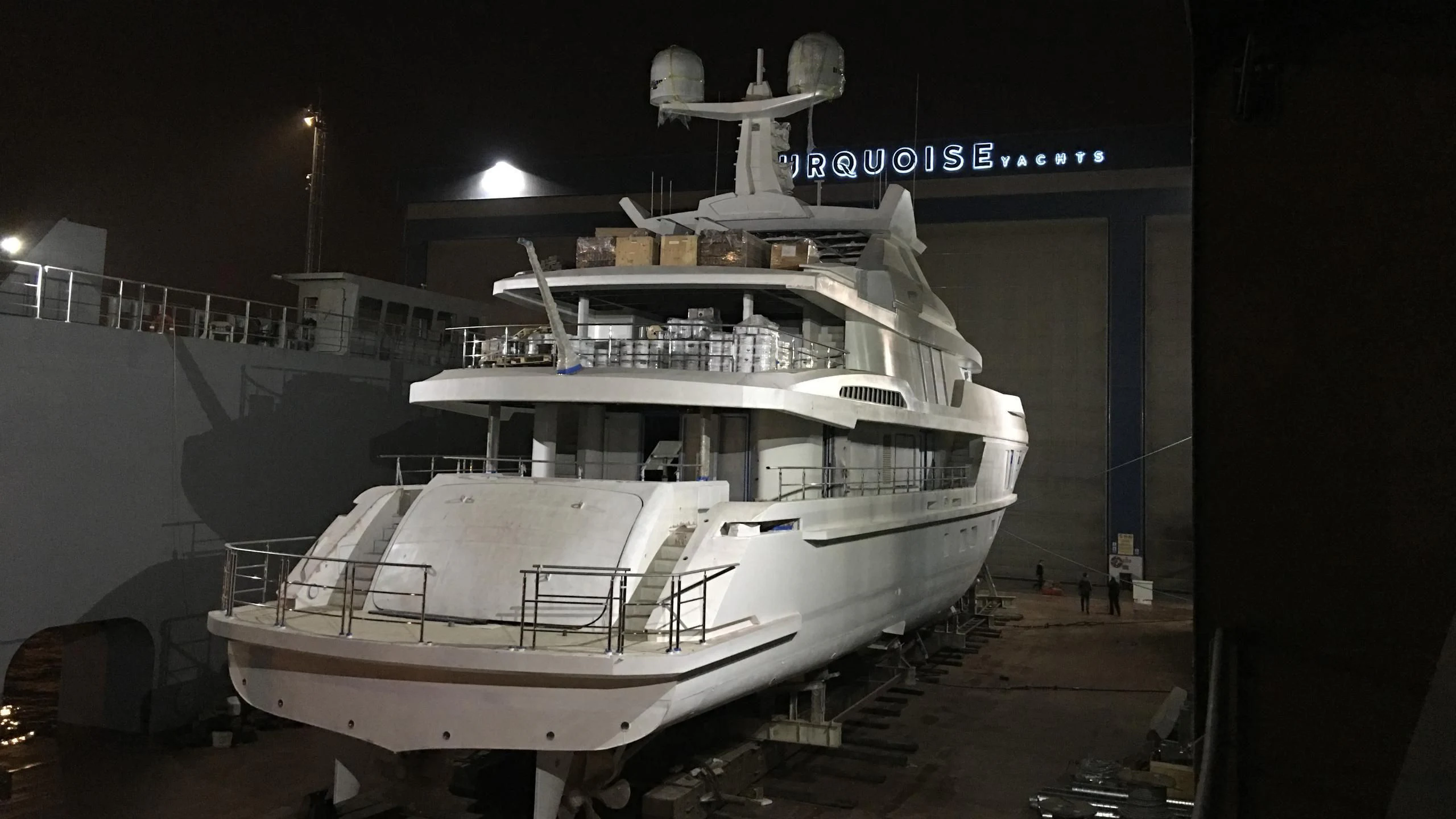 a large white boat in a dock aboard RASHA Yacht for Sale