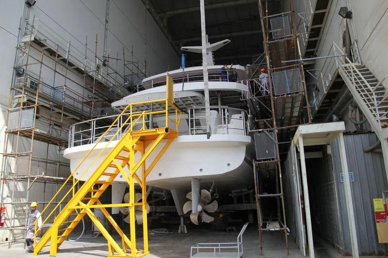 a large white machine in a factory aboard RASHA Yacht for Sale