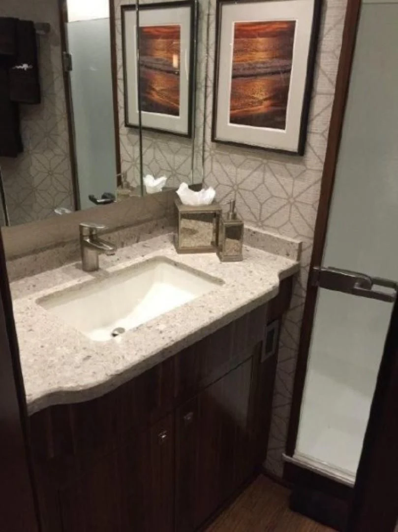 a bathroom with a sink and mirror aboard GALATI  TRADE Yacht for Sale