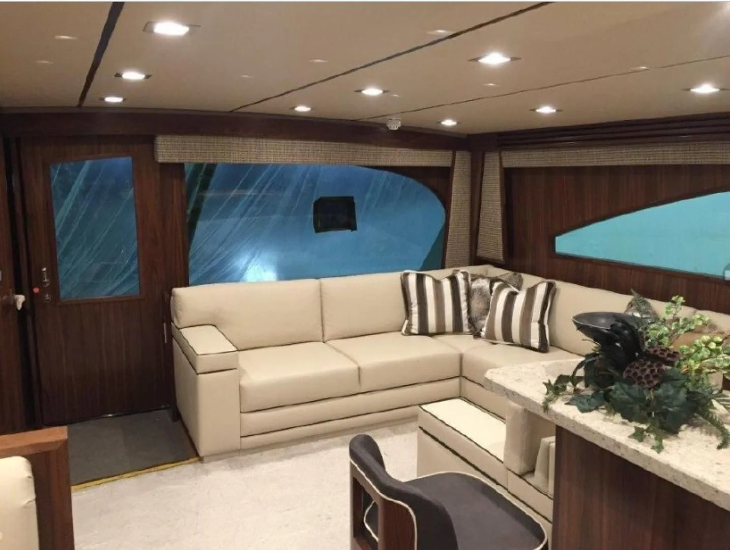 a living room with a couch and a table aboard GALATI  TRADE Yacht for Sale