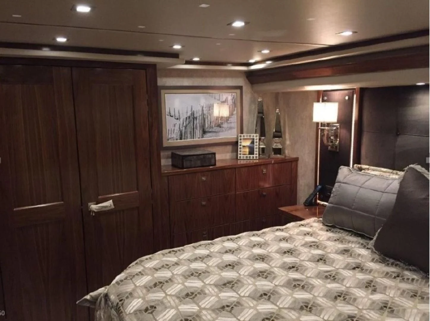 a bedroom with a bed and a television aboard GALATI  TRADE Yacht for Sale