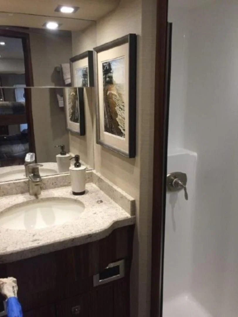 a bathroom with a sink and mirror aboard GALATI  TRADE Yacht for Sale
