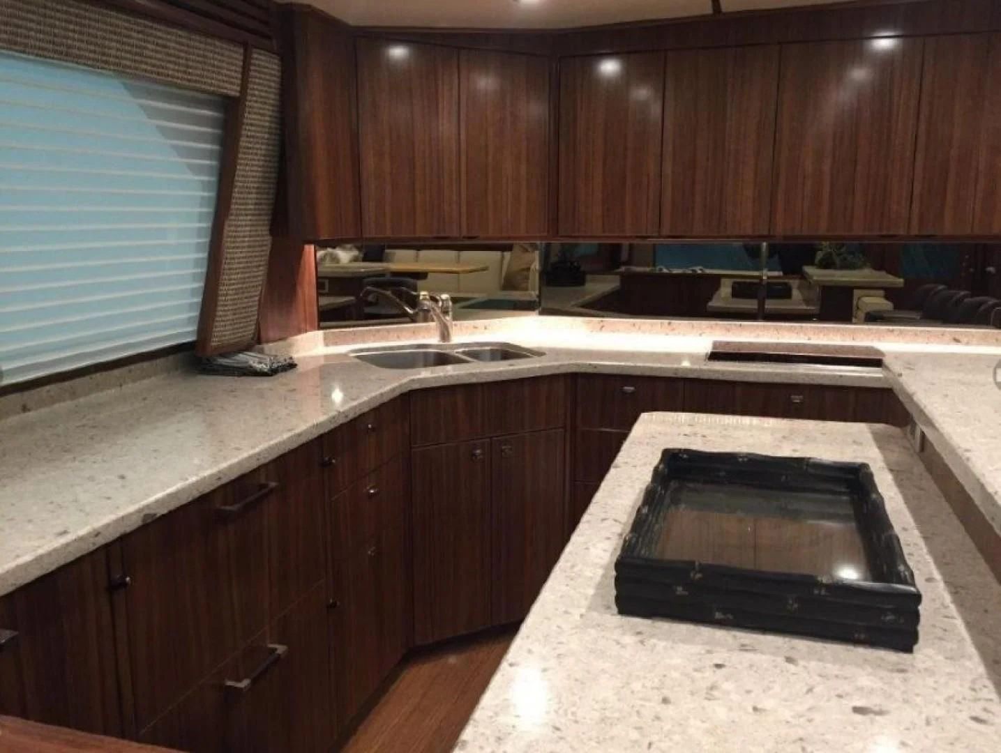 a kitchen with a black microwave aboard GALATI  TRADE Yacht for Sale