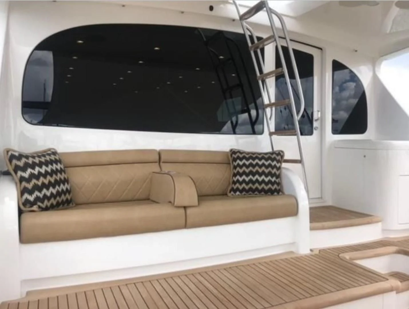 a white couch with a black frame aboard GALATI  TRADE Yacht for Sale