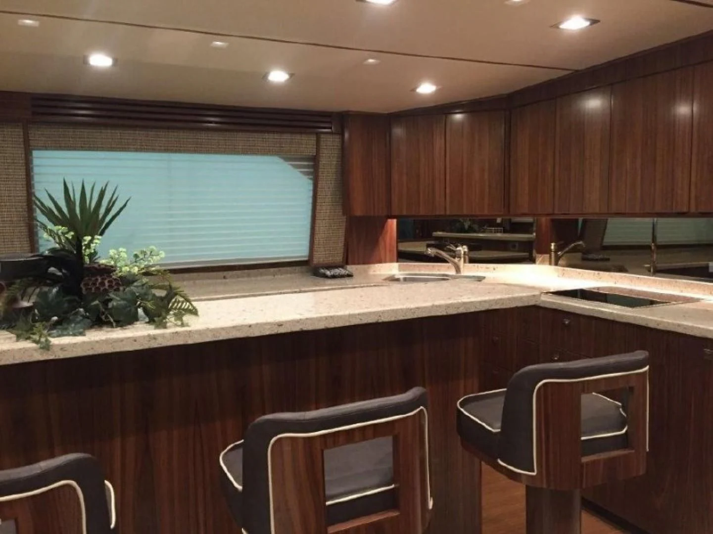 a kitchen with a large window aboard GALATI  TRADE Yacht for Sale