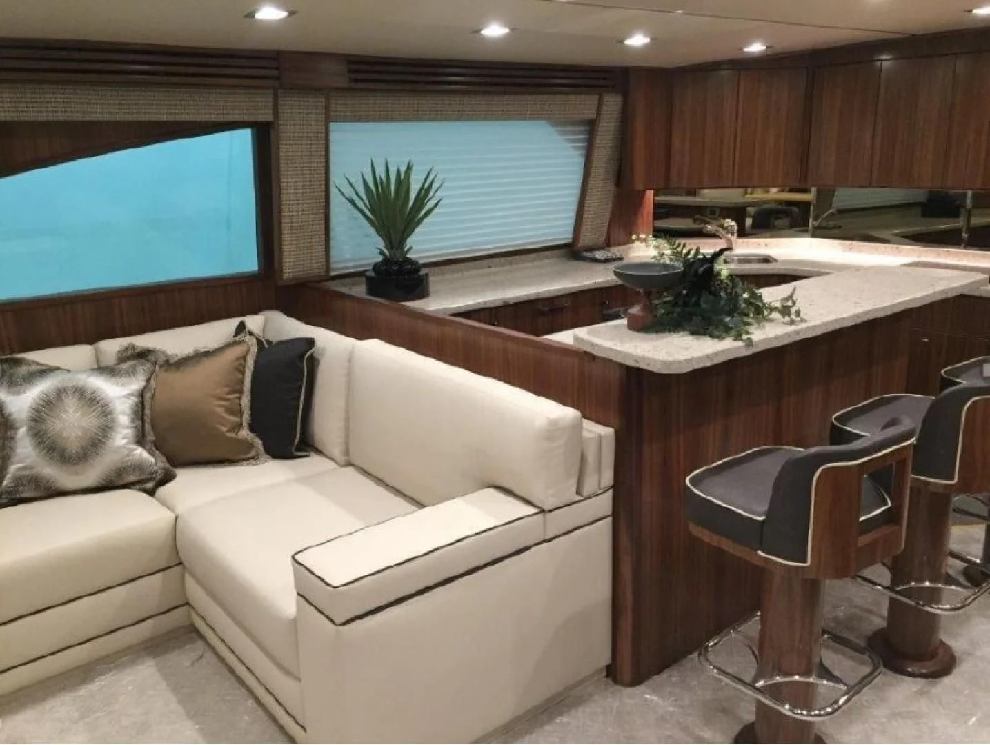 a living room with a white couch aboard GALATI  TRADE Yacht for Sale