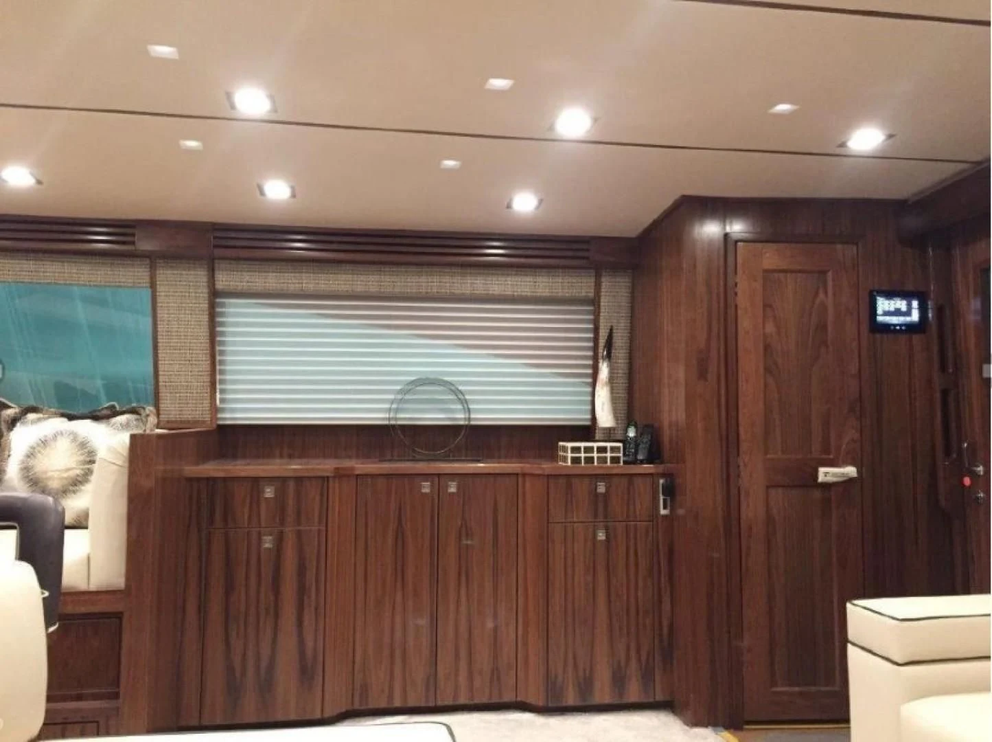 a room with a wood cabinet and a television on the wall aboard GALATI  TRADE Yacht for Sale
