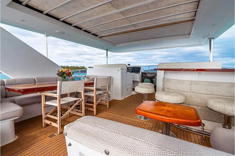 a room with a bed and a table aboard BRANDI WINE Yacht for Charter