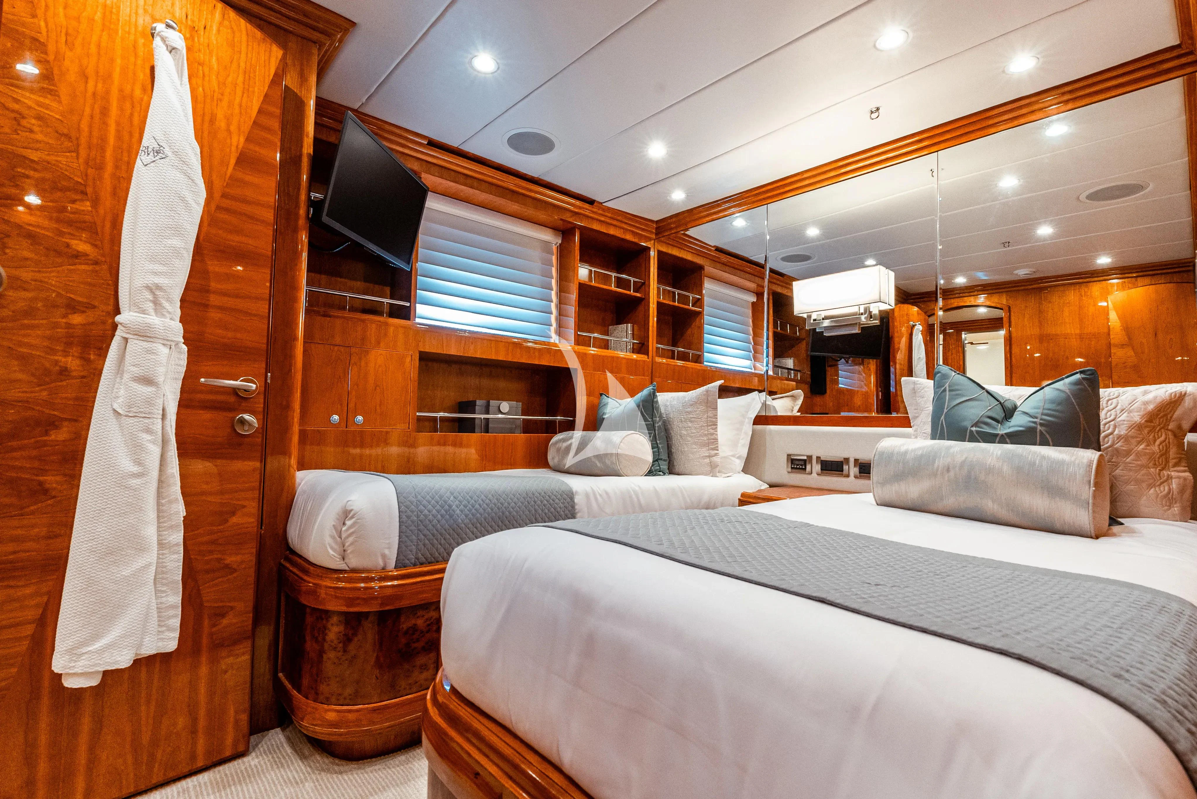 a room with a bed and a couch aboard BRANDI WINE Yacht for Charter