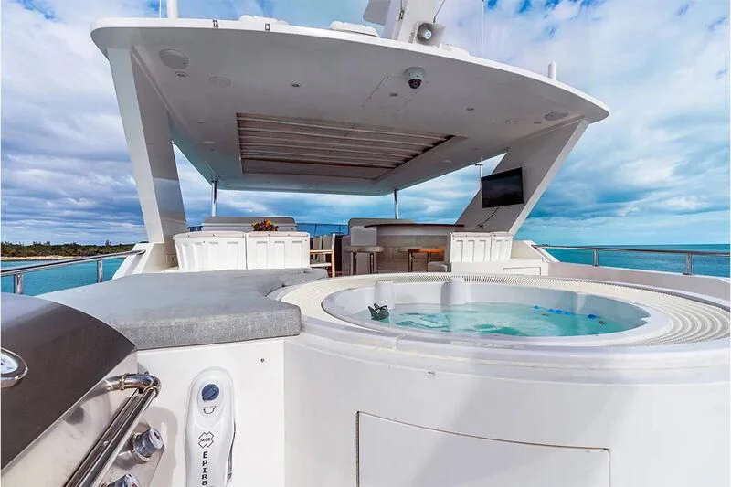 a large white boat with a pool aboard BRANDI WINE Yacht for Charter