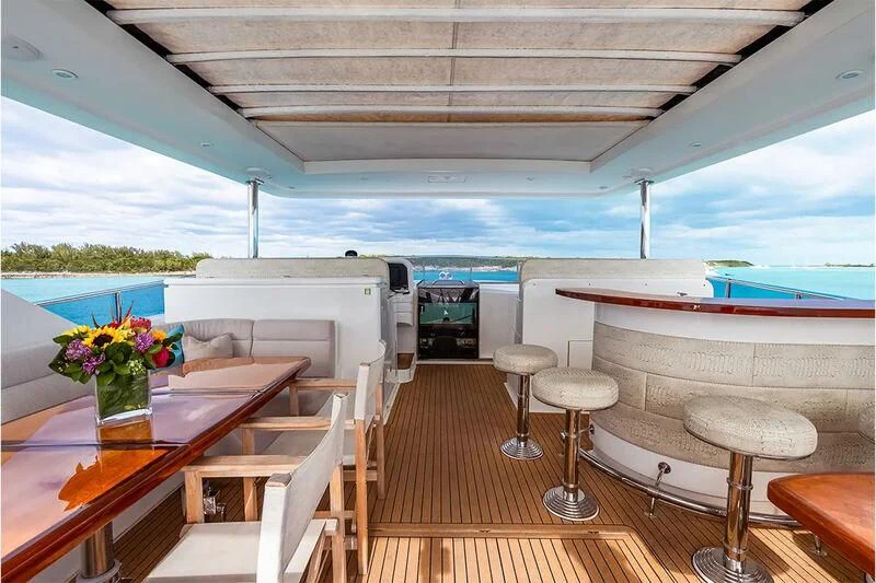 a boat with tables and chairs aboard BRANDI WINE Yacht for Charter