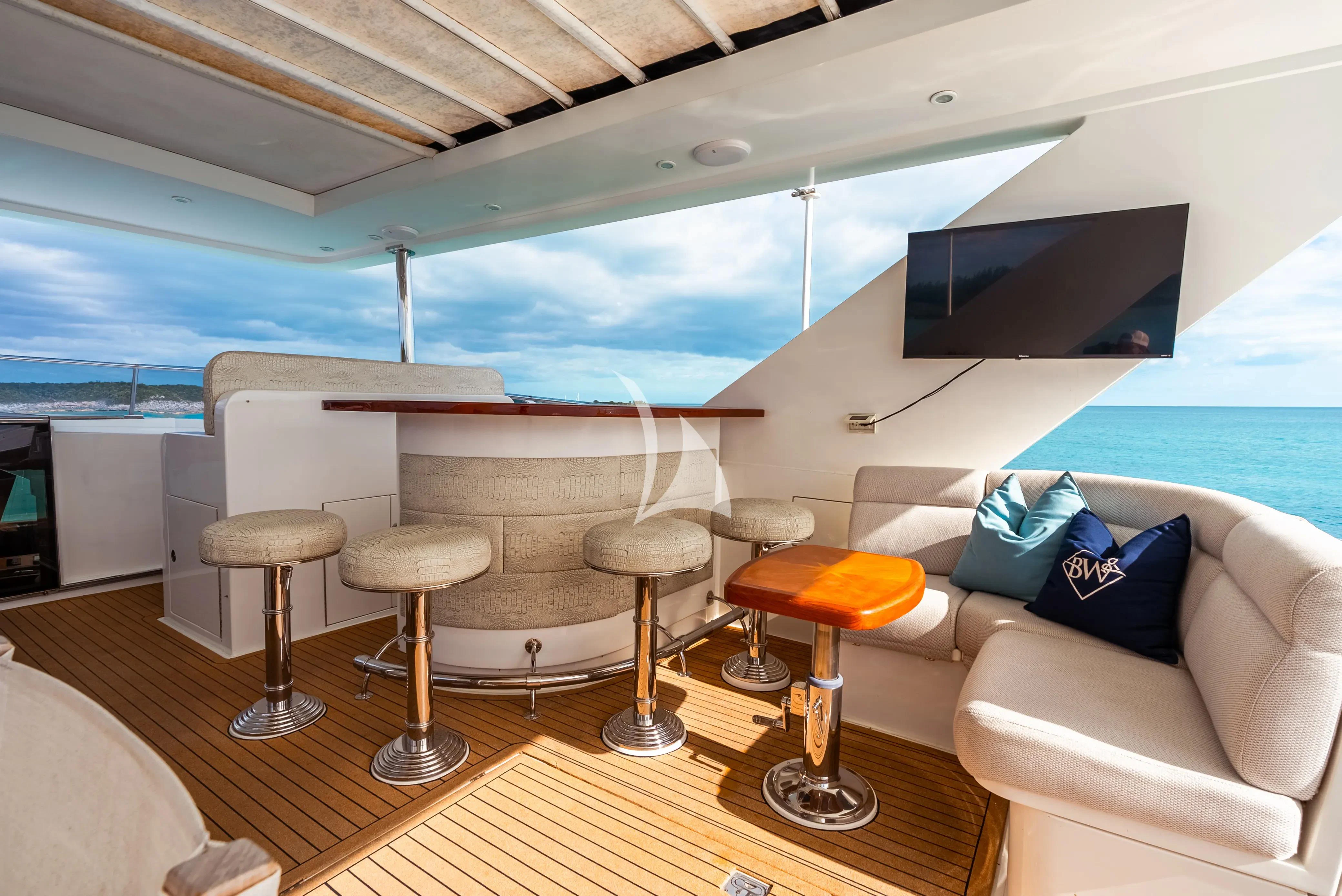 a room with a couch and a tv aboard BRANDI WINE Yacht for Charter