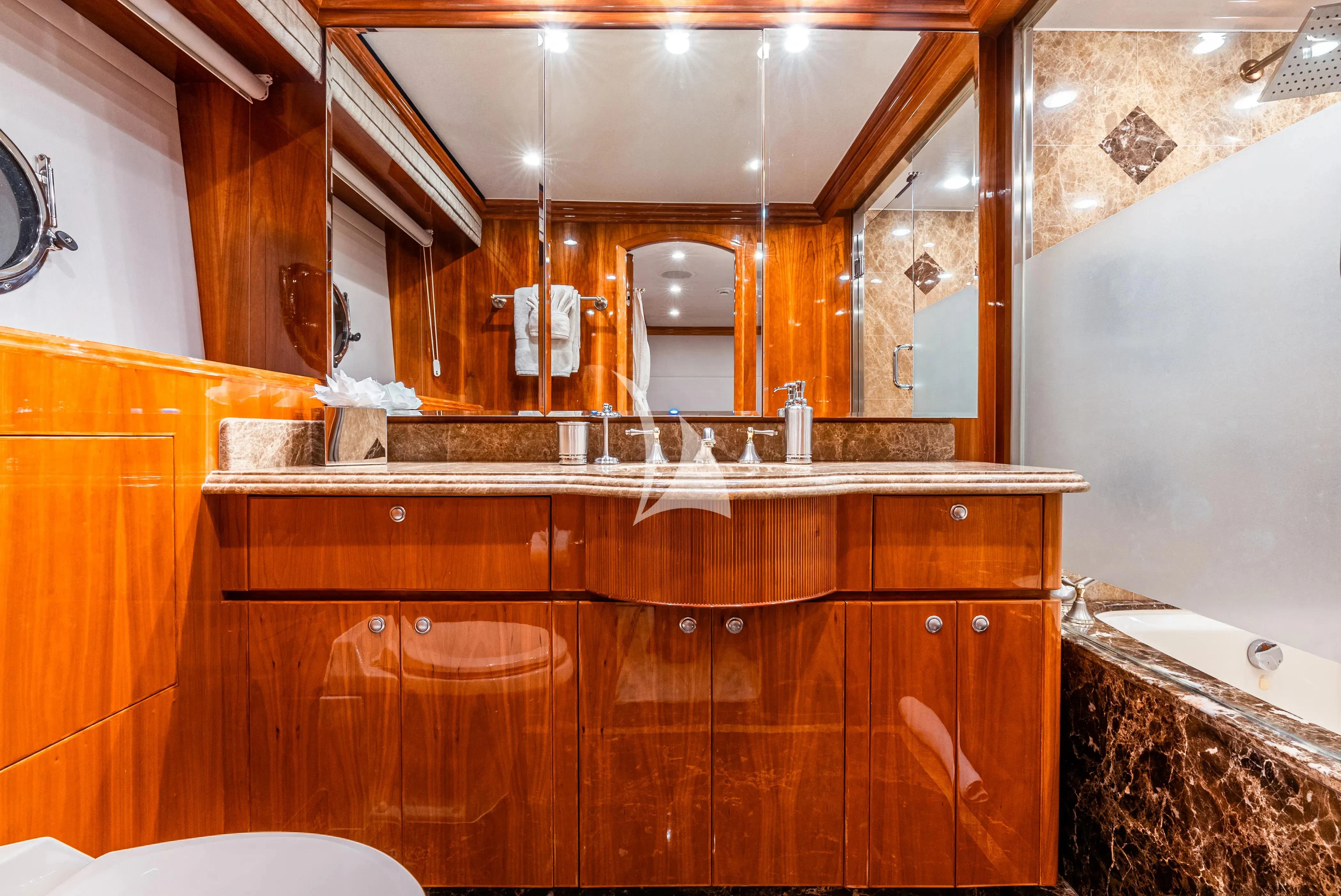 a kitchen with wooden cabinets aboard BRANDI WINE Yacht for Charter