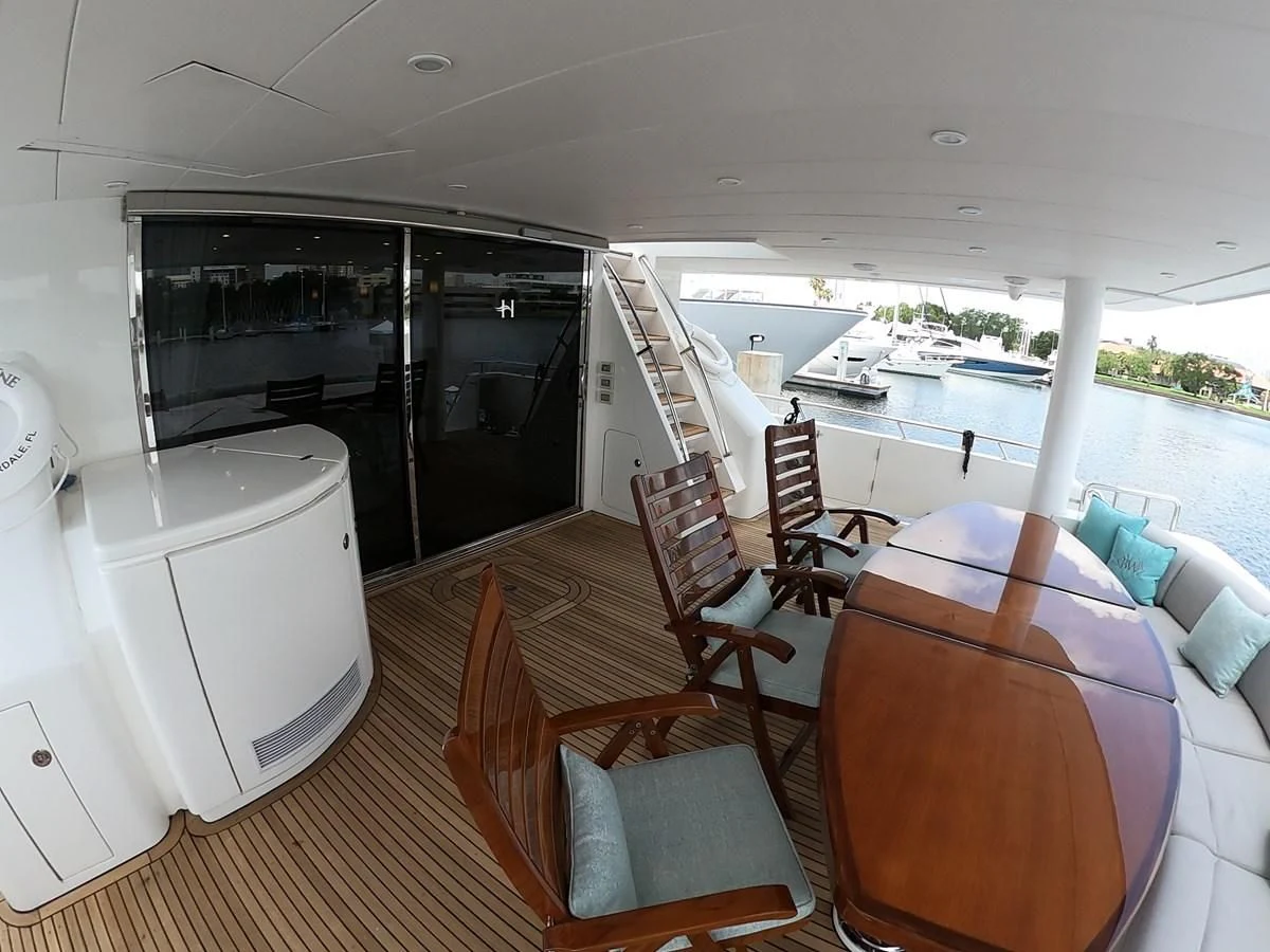 a living room with a large open plan kitchen and dining area aboard BRANDI WINE Yacht for Charter