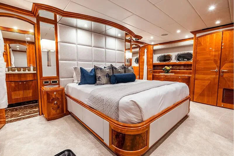 a bedroom with a large bed aboard BRANDI WINE Yacht for Charter