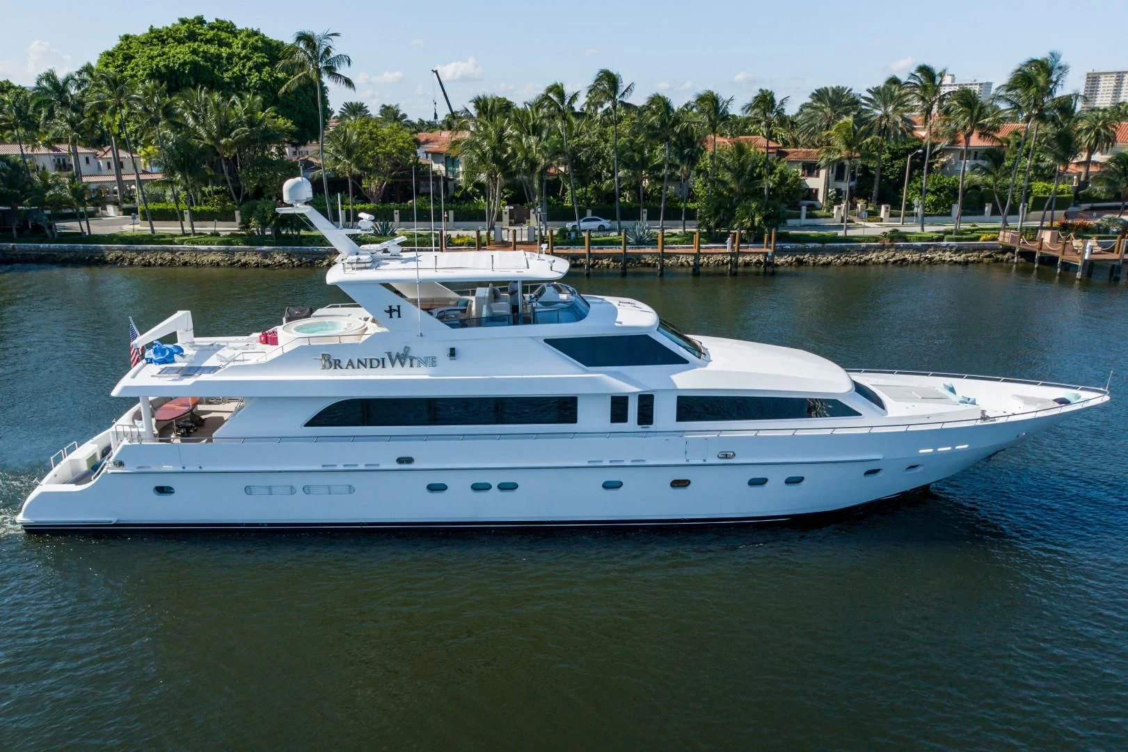 a white yacht in a harbor aboard BRANDI WINE Yacht for Charter